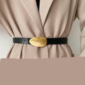 Black genuine leather belts fitted with gold buckles